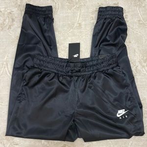 NWOT Nike Shiny  looking Joggers. Size M